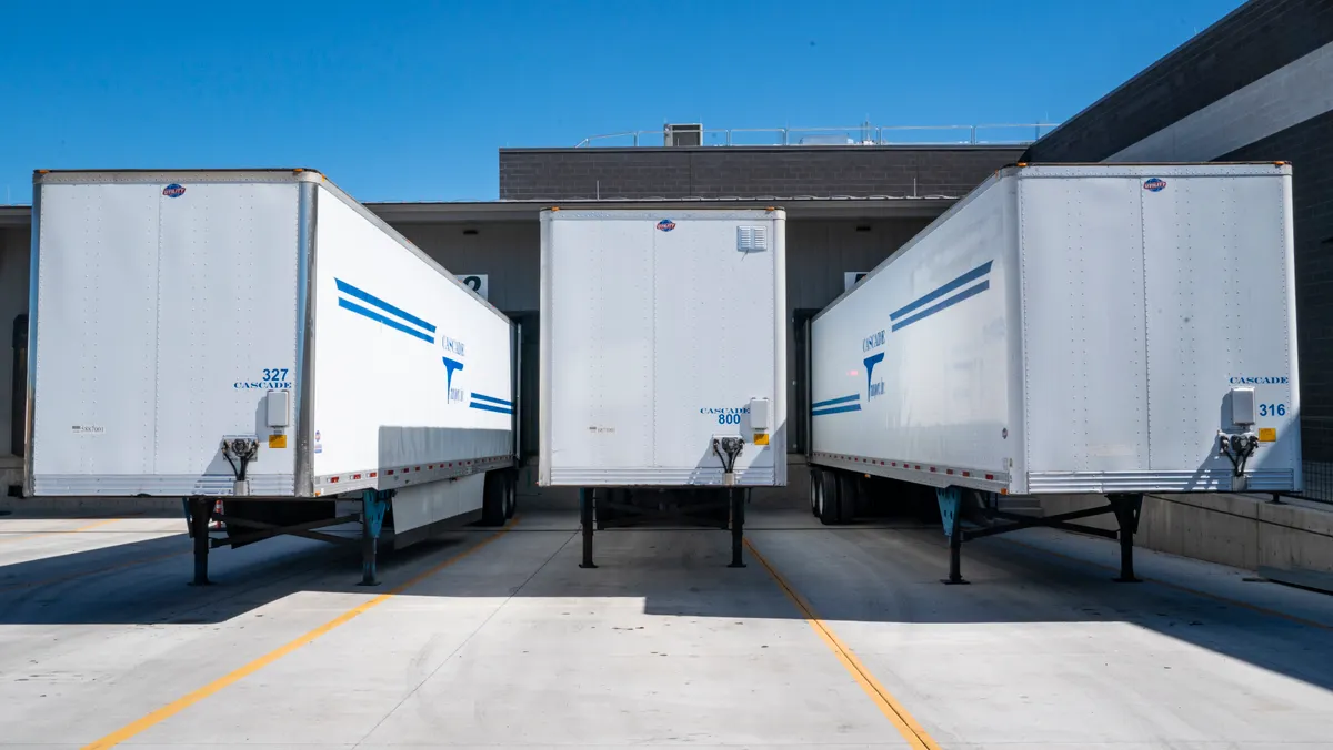 Trucks lined up at a distribution warehouse loading dock