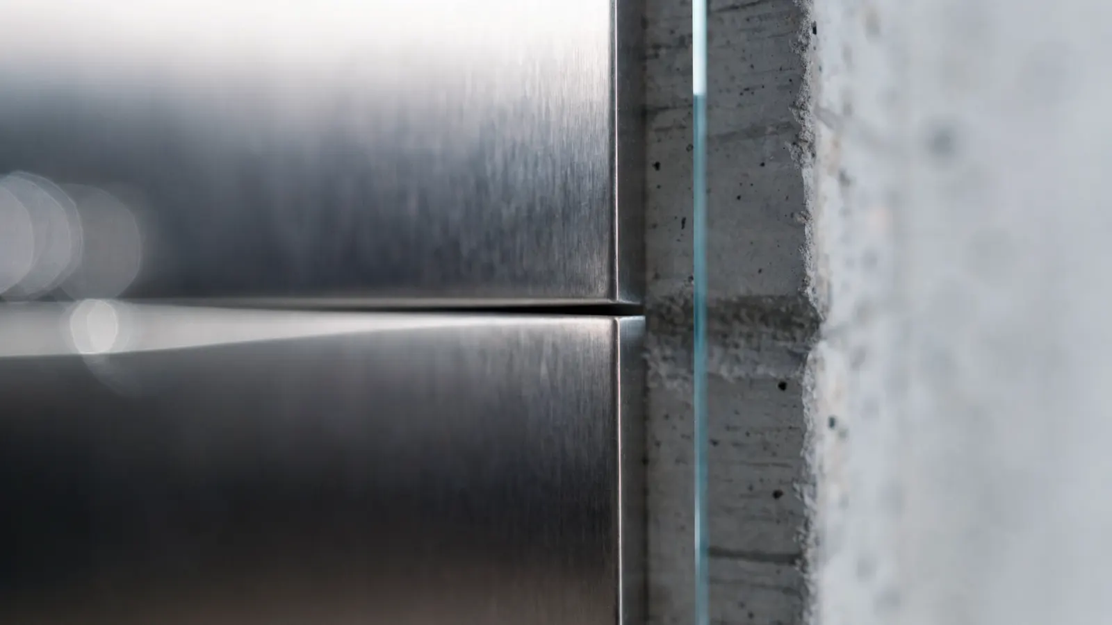 A dimensioned detail drawing overlaid on a photographed edge, illustrating an essay on tolerance and the millimeter.